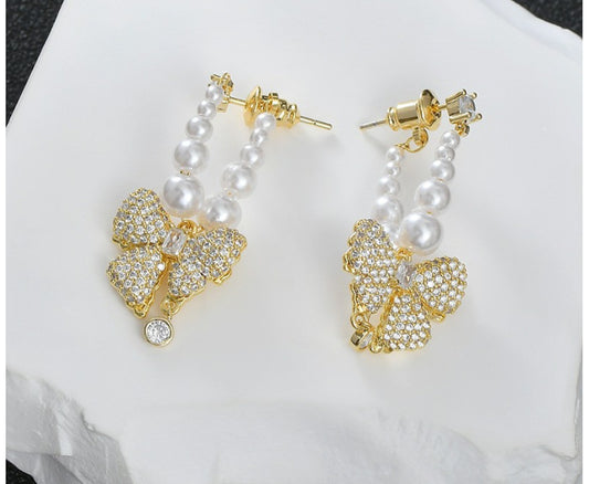 Kolczyki złote kokardki z cyrkoniami