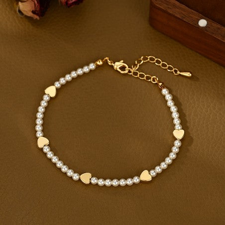 Bransoletka złota z perłami i sercami